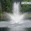 Artemis fountain nozzle creating a symmetrical and striking water display in a pond.