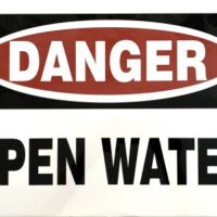Danger Open Water sign for safety awareness